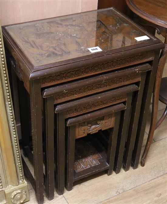 A nest of four Chinese tables, H.65cm